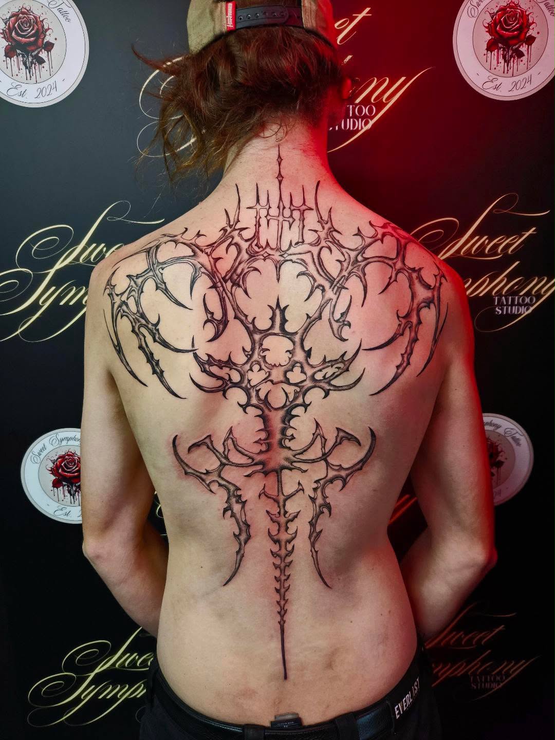 Bold blackwork gothic back piece tattoo from Sweet Symphony Tattoo Instagram