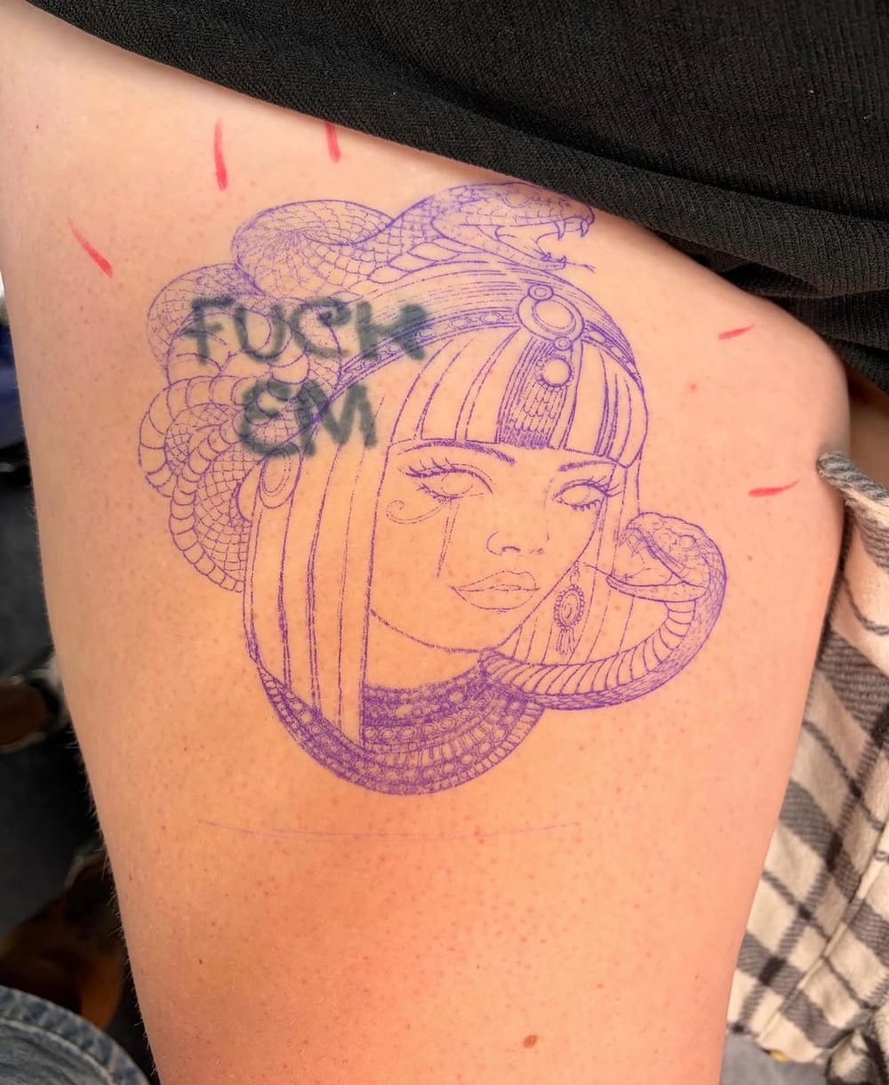 Stencil placement before a thigh cover-up tattoo by Lilly at Sweet Symphony Tattoo