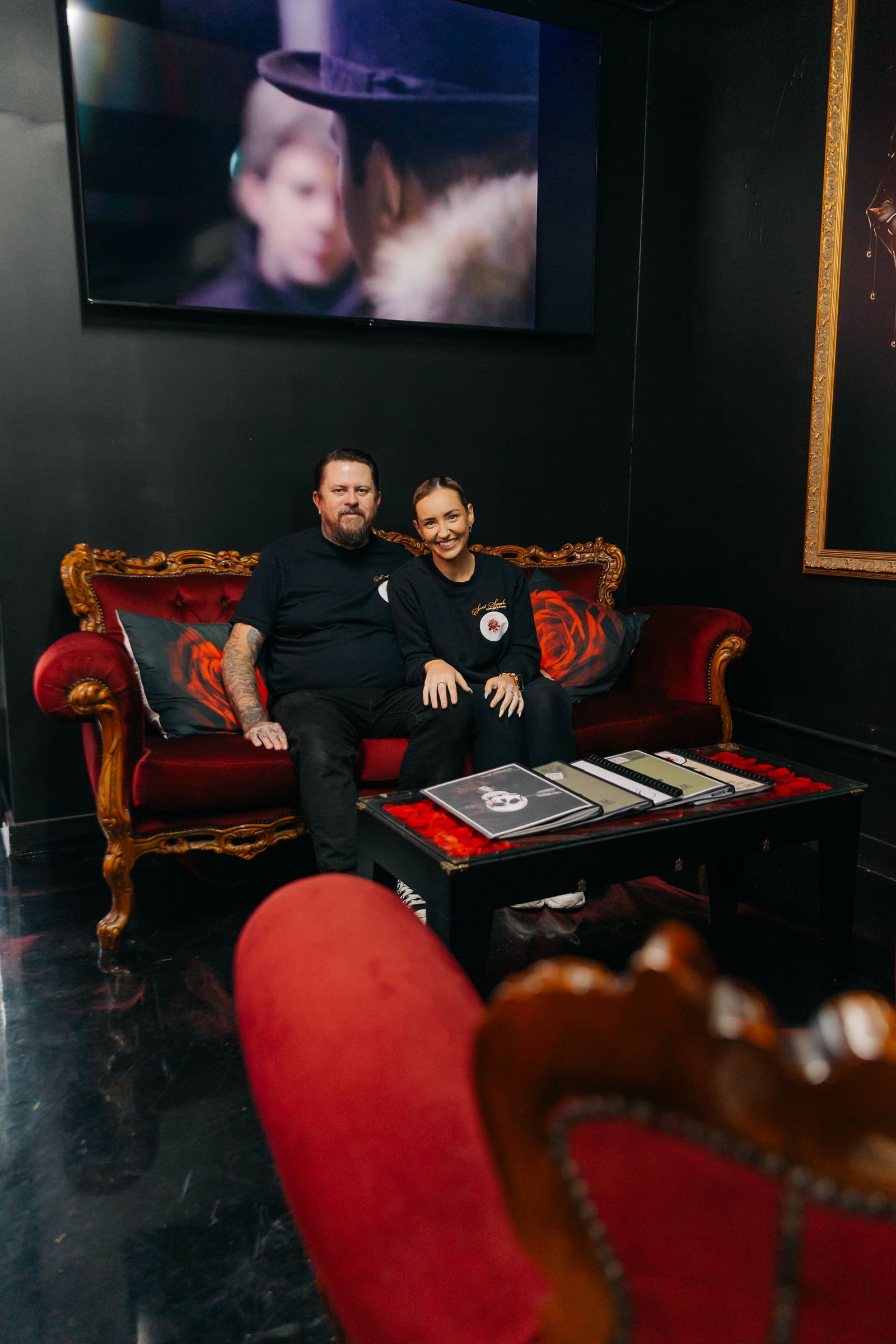Joe and Sarah, owners of Sweet Symphony Tattoo, in the studio