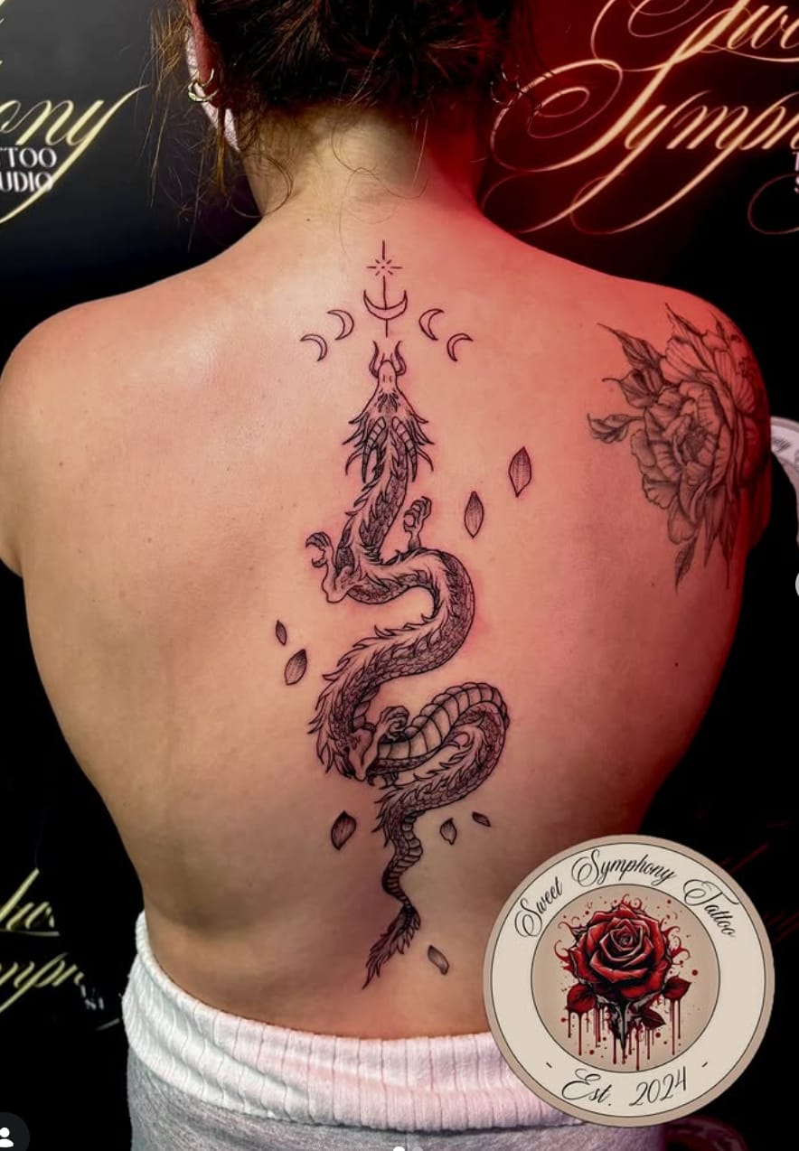 Fine line dragon back piece tattoo by Sweet Symphony Tattoo